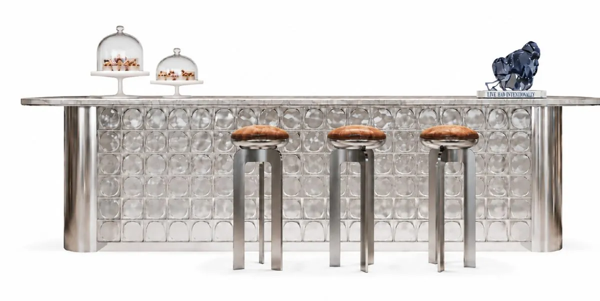 The Bubble Block — an embossed-chrome sculptural counter in the clubhouse